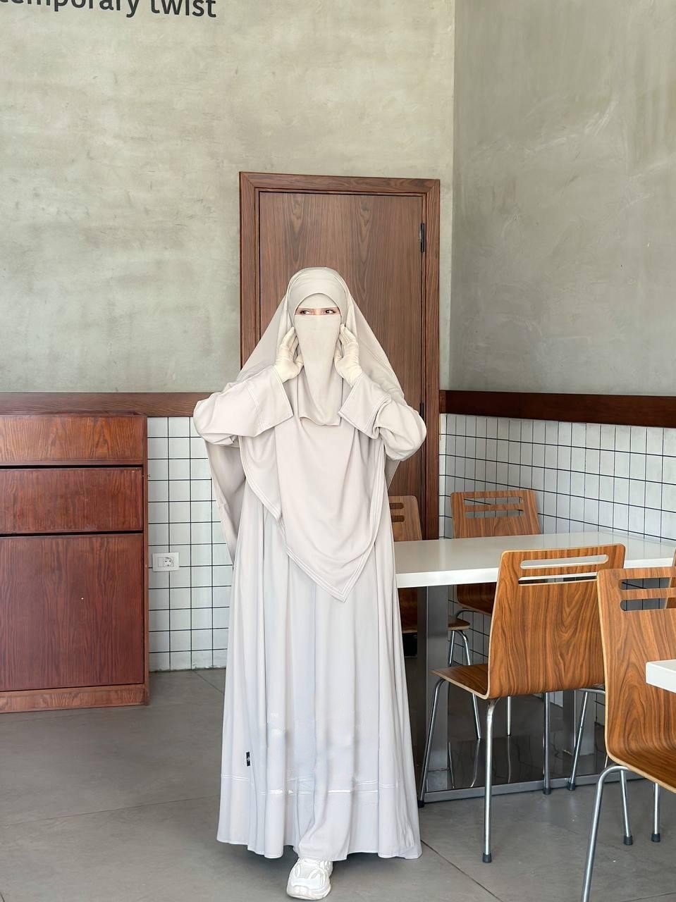 Front view of the Souda Beige premium modest set featuring white contrast stitching and an integrated niqab.